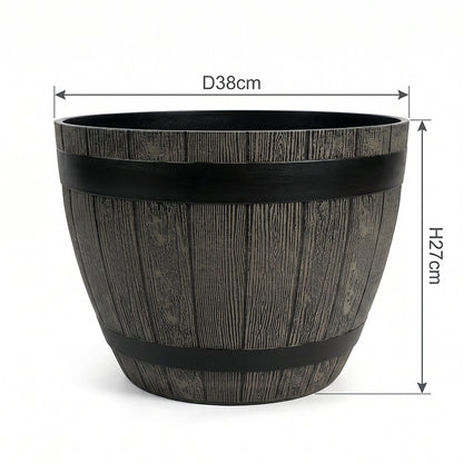 A dark gray faux-wood barrel planter with black metal bands, shown with dimension lines indicating a diameter of 38cm and a height of 27cm on a white background.